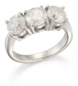 AN 18 CARAT WHITE GOLD DIAMOND THREE STONE RING