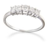 A 9 CARAT WHITE GOLD DIAMOND HALF HOOP RING