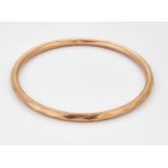 A 9 CARAT ROSE GOLD BANGLE