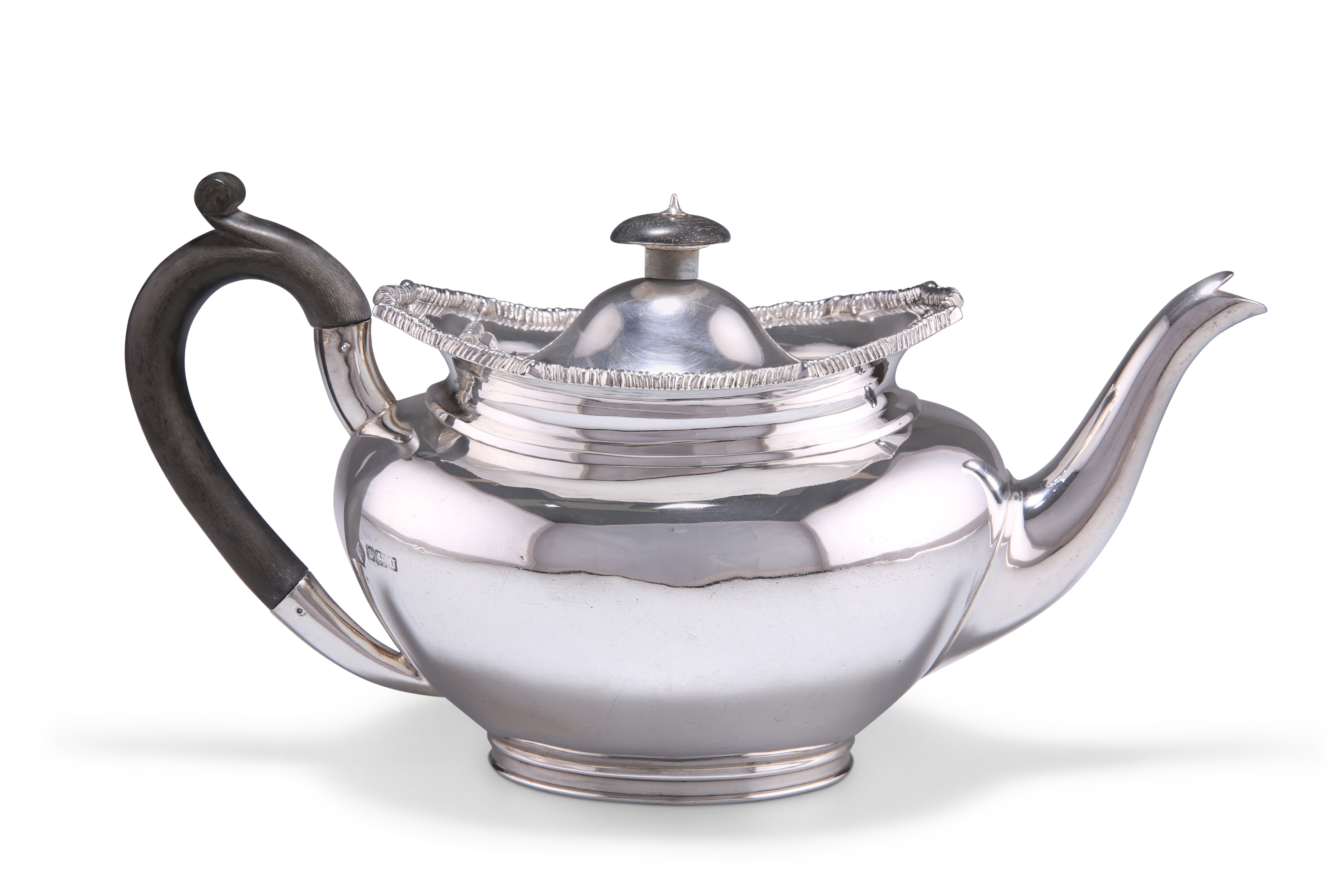 AN EDWARDIAN SILVER TEAPOT