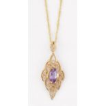 A 9 CARAT GOLD AMETHYST PENDANT ON A 9 CARAT GOLD FANCY CHAIN