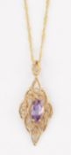 A 9 CARAT GOLD AMETHYST PENDANT ON A 9 CARAT GOLD FANCY CHAIN
