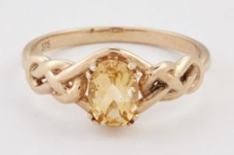 A 9 CARAT GOLD CITRINE RING