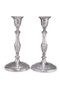 A PAIR OF GEORGE V SILVER CANDLESTICKS