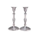 A PAIR OF GEORGE V SILVER CANDLESTICKS