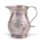 AN EARLY GEORGE II SILVER CREAM JUG