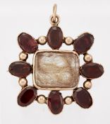 A GARNET MOURNING BROOCH