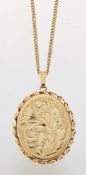 A 9 CARAT GOLD LOCKET PENDANT ON CHAIN