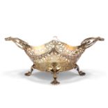 AN EDWARDIAN SILVER-GILT BASKET,