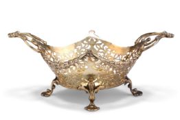 AN EDWARDIAN SILVER-GILT BASKET,