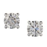 A PAIR OF SOLITAIRE DIAMOND EARRINGS