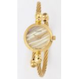 A LADY'S GOLD PLATED GUCCI BANGLE WATCH