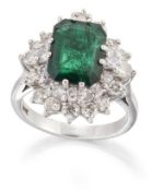 AN EMERALD AND DIAMOND CLUSTER RING