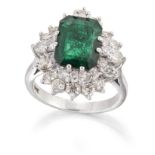 AN EMERALD AND DIAMOND CLUSTER RING