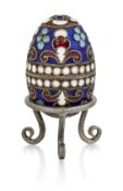A SMALL RUSSIAN SILVER AND ENAMEL EGG