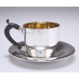 AN EDWARDIAN SILVER CUP AND SAUCER