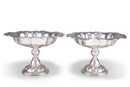 A NEAR PAIR OF EDWARDIAN SILVER COMPORTS