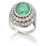 AN EMERALD AND DIAMOND CLUSTER RING