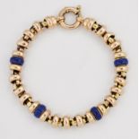 A 9 CARAT BI-COLOUR GOLD AND BLUE ENAMEL BRACELET