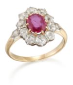 AN EARLY 20TH CENTURY RUBY AND DIAMOND CLUSTER RING