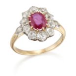 AN EARLY 20TH CENTURY RUBY AND DIAMOND CLUSTER RING