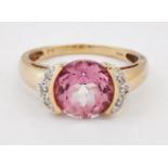 A PINK TOPAZ AND DIAMOND RING