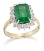 AN 18 CARAT GOLD EMERALD AND DIAMOND CLUSTER RING