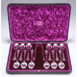 A SET OF TWELVE VICTORIAN SILVER TEASPOONS AND TONGS