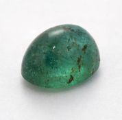 AN OVAL CABOCHON EMERALD, 1.71ct