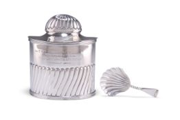 AN EDWARDIAN SILVER TEA CADDY AND SPOON