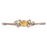 AN ARTS AND CRAFTS CITRINE BROOCH