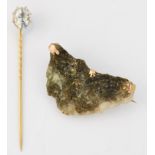 A ROCK CRYSTAL STICK PIN AND A VICTORIAN GOLD IN QUARTZ ROCK BROOCH (2)