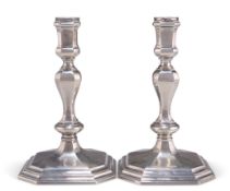 A PAIR OF ELIZABETH II CAST SILVER CANDLESTICKS