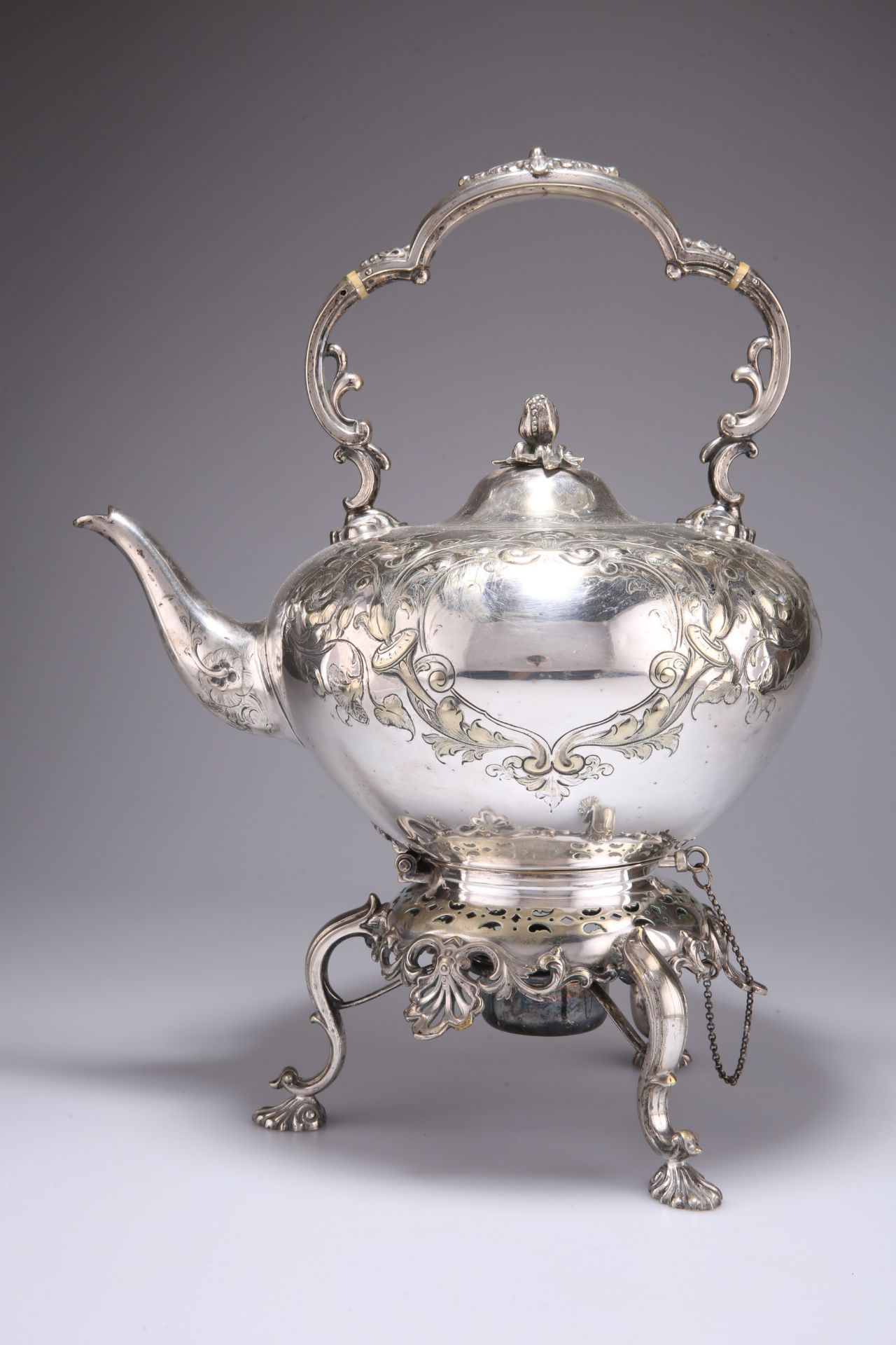 A VICTORIAN SILVER-PLATED SPIRIT KETTLE ON STAND