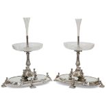 A HANDSOME PAIR OF 19TH CENTURY SILVER-PLATED CENTREPIECES ON MIRRORED STANDS