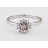 A 9 CARAT WHITE GOLD PINK STONE AND DIAMOND CLUSTER RING