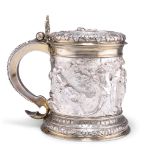 AN IMPRESSIVE VICTORIAN SILVER AND PARCEL-GILT TANKARD