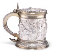 AN IMPRESSIVE VICTORIAN SILVER AND PARCEL-GILT TANKARD