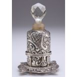 AN EDWARDIAN SILVER-MOUNTED SCENT BOTTLE