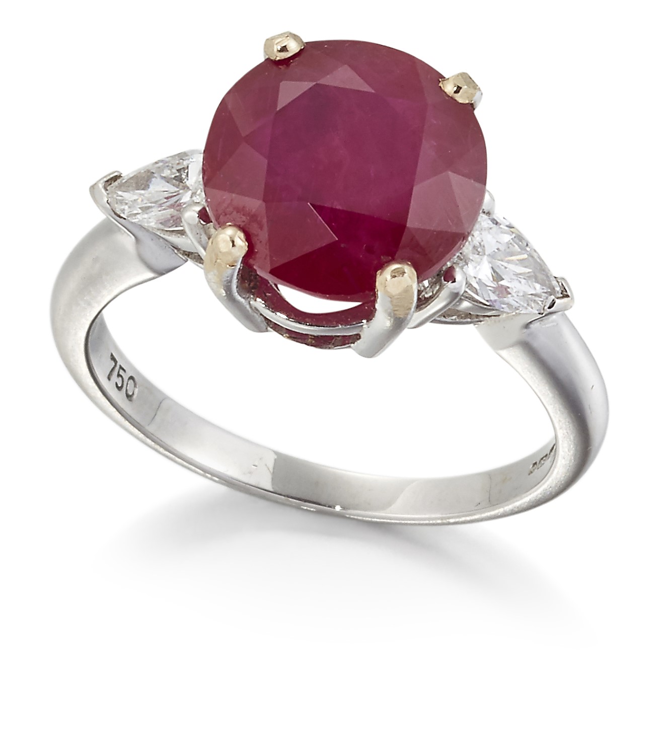 AN 18CT WHITE GOLD RUBY AND DIAMOND THREE STONE RING