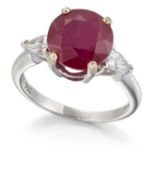 AN 18CT WHITE GOLD RUBY AND DIAMOND THREE STONE RING