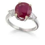 AN 18CT WHITE GOLD RUBY AND DIAMOND THREE STONE RING