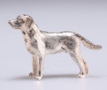 AN ELIZABETH II CAST SILVER MODEL OF A DOG