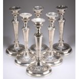 A RARE SET OF SIX GEORGE III LARGE SILVER TABLE CANDLESTICKS