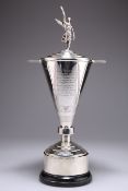 AN ART DECO SILVER TROPHY AND COVER ON STAND