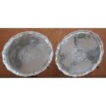 A LARGE PAIR OF GEORGE III SILVER SALVERS