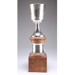 A BRITANNIA SILVER TROPHY CUP ON A MOUSEMAN OAK STAND