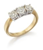 AN 18CT GOLD DIAMOND THREE STONE RING