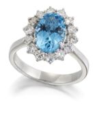 A BLUE TOPAZ AND DIAMOND CLUSTER RING