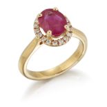 AN 18CT GOLD RUBY AND DIAMOND CLUSTER RING